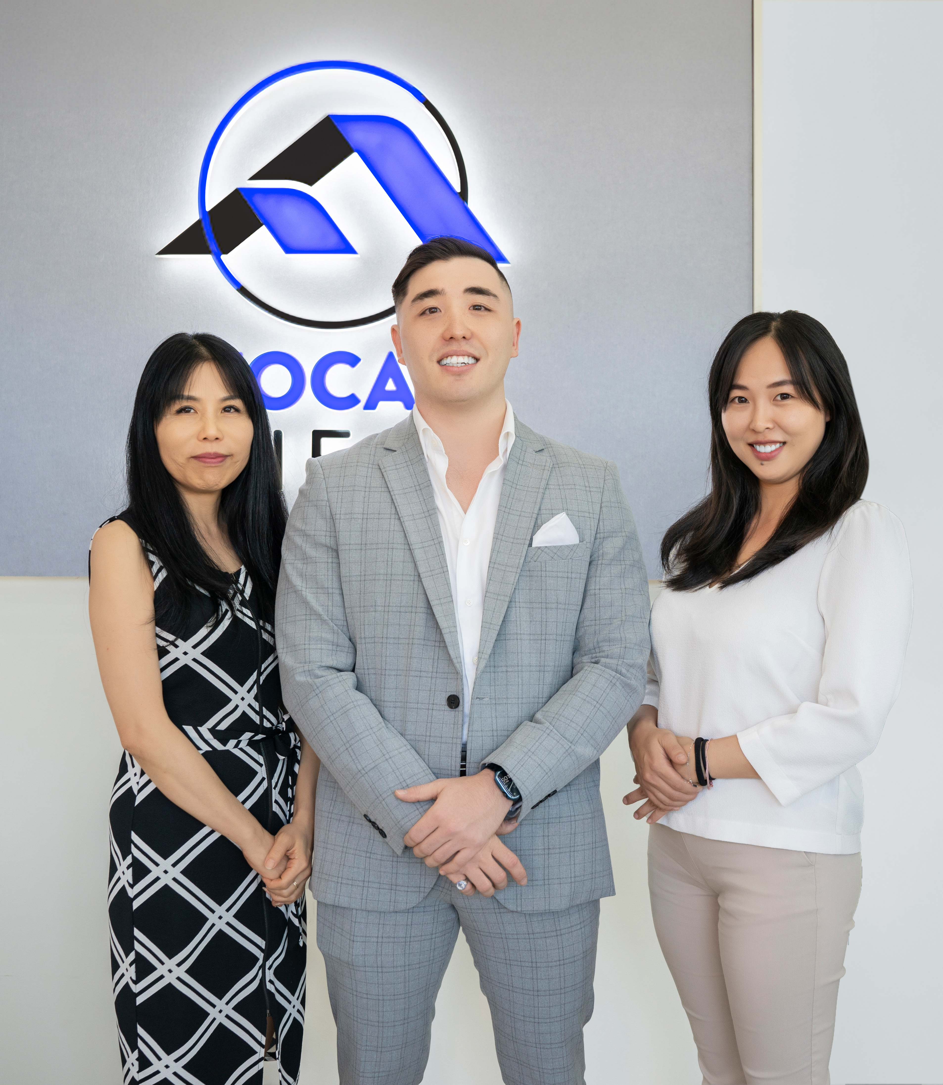 Jade Soong, Philip Paznikov and Serena Wang at the Focal Real Estate office
